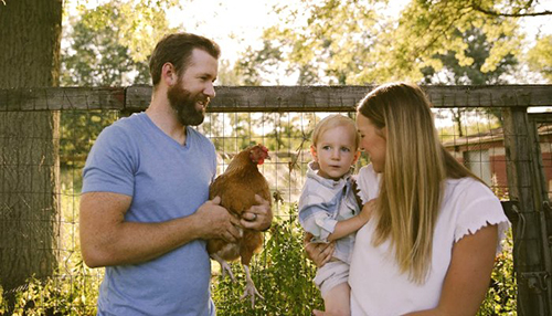 family with chickens